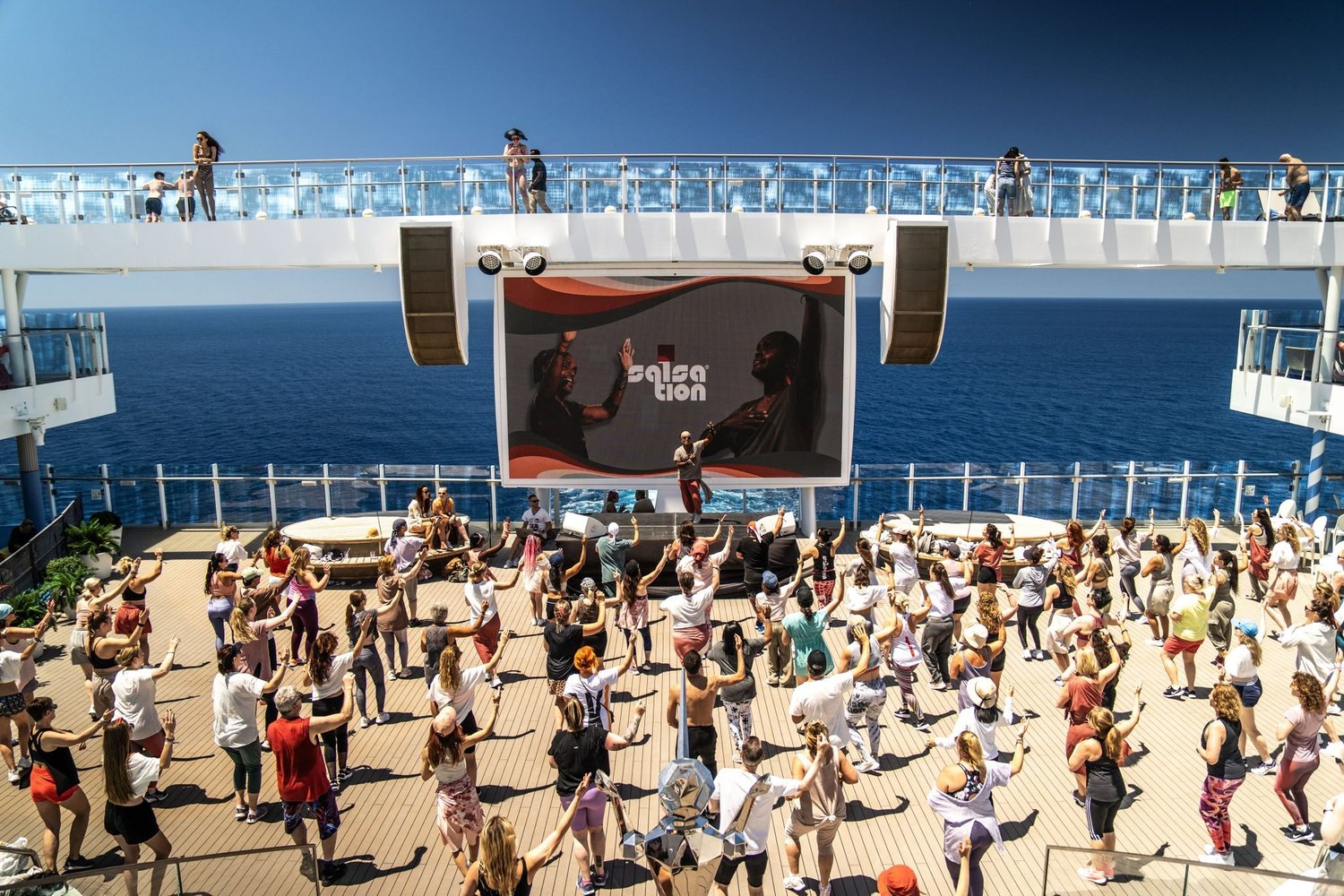 SALSATION community dancing together on a cruise ship